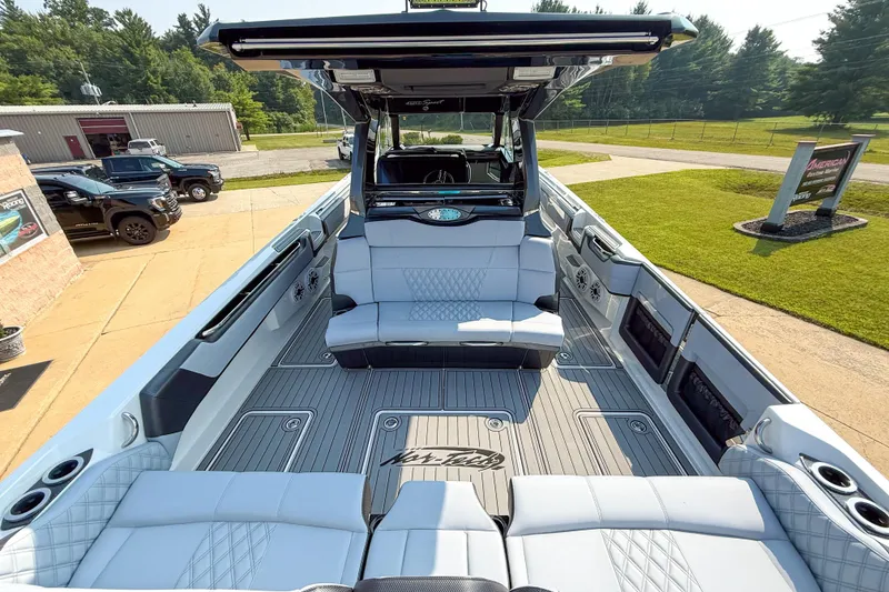 Slide: The Image of 2019 Nor-Tech 450 Sport Center Console boat with luxurious seating and modern design. - 5