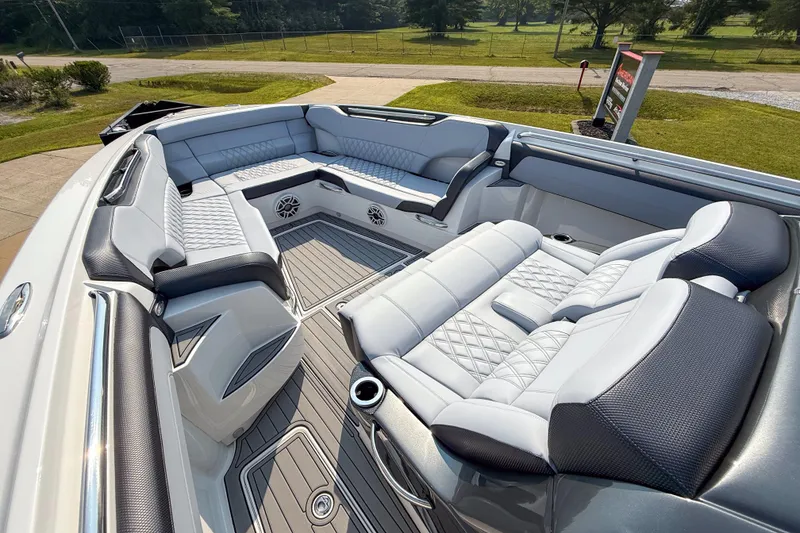 Slide: The Image of Luxurious seating on 2019 Nor-Tech 450 Sport Center Console boat, featuring elegant upholstery and spacious layout. - 7