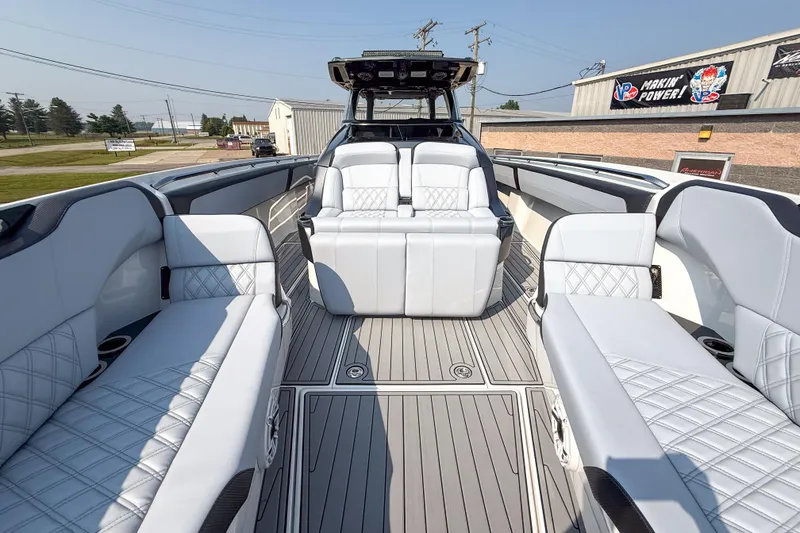 Slide: The Image of 2019 Nor-Tech 450 Sport Center Console with luxurious seating and sleek design. - 8