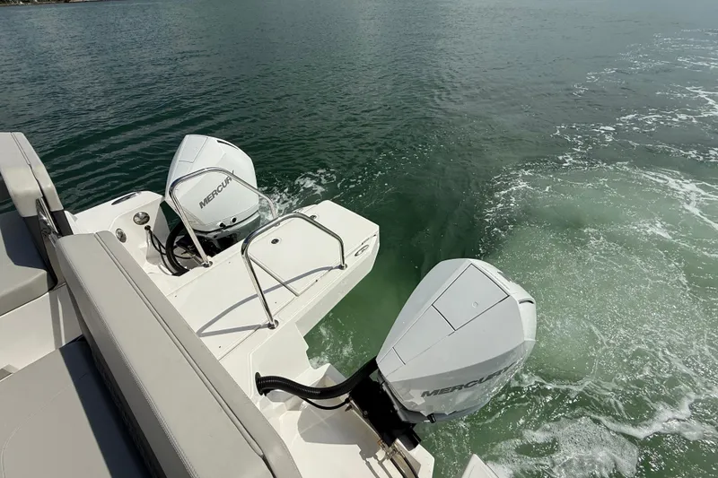 Slide: The Image of Aquila 32 Sport 2025 boat with dual Mercury outboard engines on water. - 14