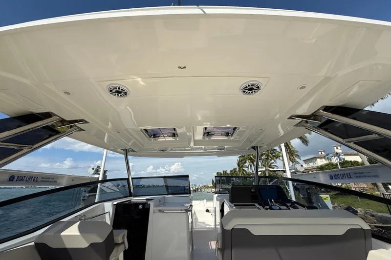Slide: The Image of 2025 Aquila 32 Sport boat interior with modern design and ocean view. - 25