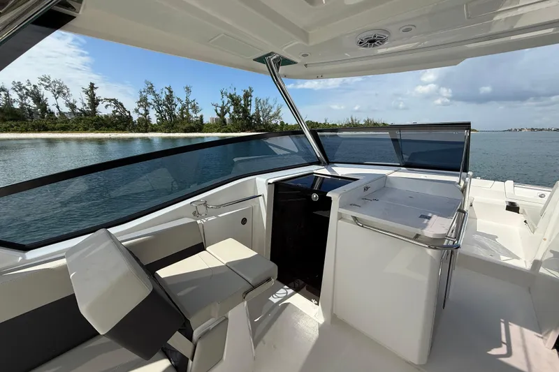 Slide: The Image of 2025 Aquila 32 Sport boat interior with sleek design and waterfront view. - 32