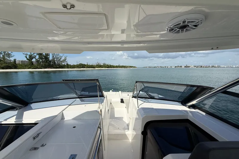 Slide: The Image of 2025 Aquila 32 Sport boat interior with ocean view and clear skies. - 38