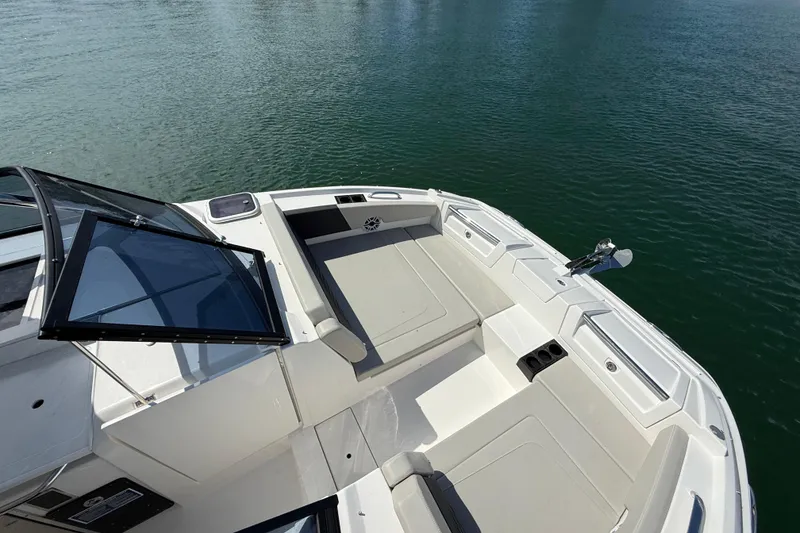 Slide: The Image of Aquila 32 Sport 2025 boat deck with seating, on calm water. - 39