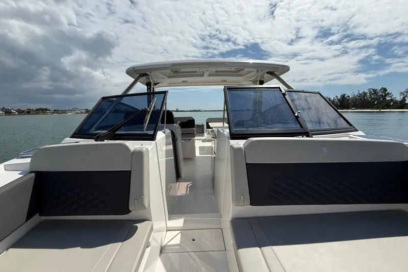Slide: The Image of Aquila 32 Sport 2025 boat on water, featuring sleek design and spacious seating. - 43
