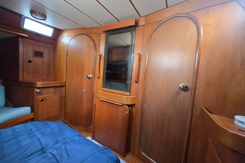 Slide: The Image of Interior of 1985 Swan 46 yacht with wooden stairs and cabin view. - 21