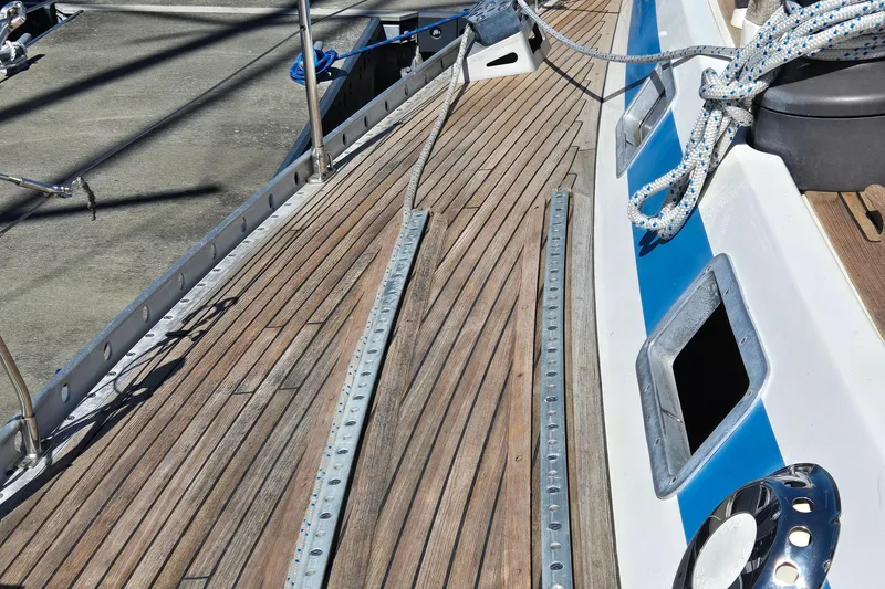 Slide: The Image of Cozy cabin bedroom in 1985 Swan 46 yacht with warm lighting and blue bedding. - 31