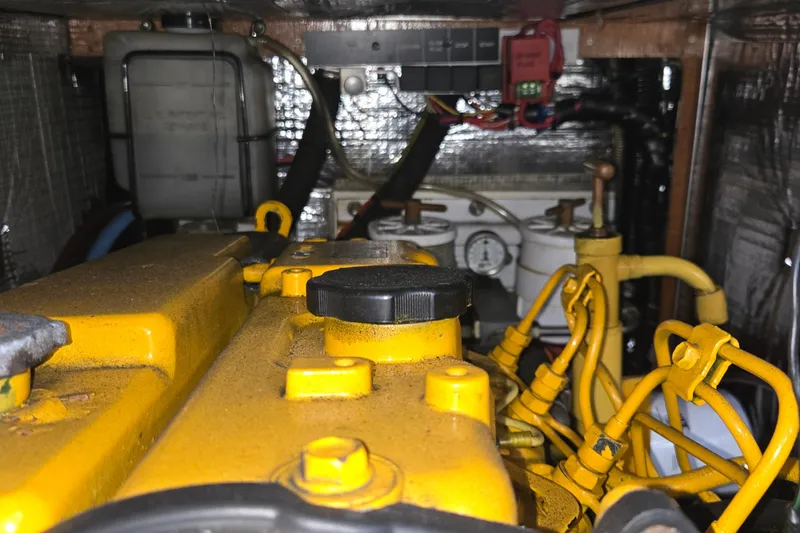 Slide: The Image of Compact bathroom in a 1985 Swan 46 yacht, featuring a sink and marine toilet. - 34