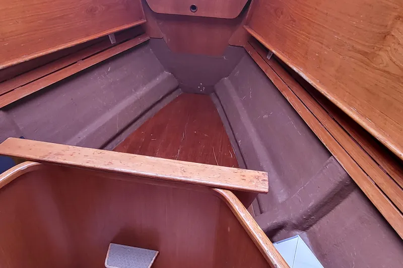 Slide: The Image of Swan 46 sailboat from 1985 docked, showcasing rigging and deck details. - 7