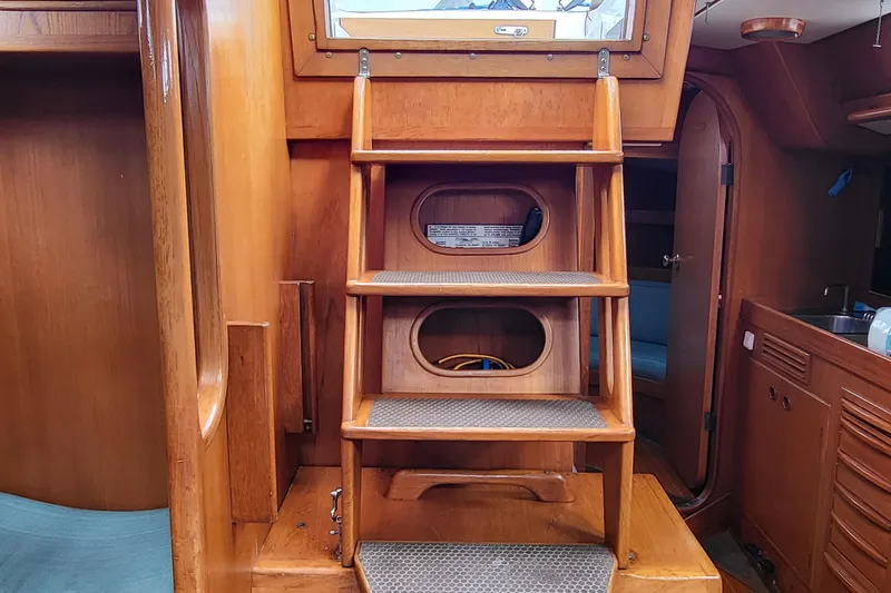 Slide: The Image of Deck view of 1985 Swan 46 yacht docked at marina with ropes and winches. - 9