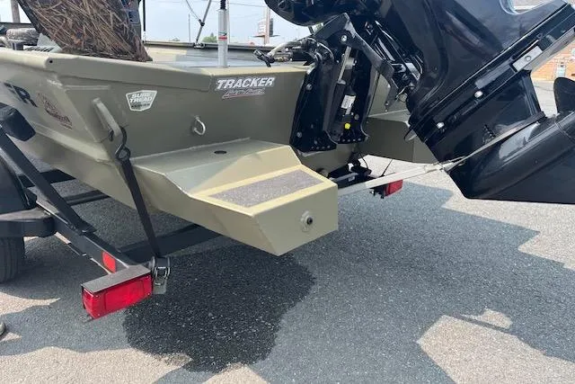 Slide: The Image of 2020 Tracker Grizzly 1860 CC boat rear view with motor and trailer. - 7