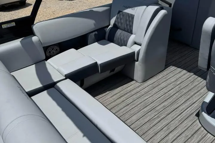 Slide: The Image of 2020 Harris Solstice 250 boat interior with gray seating and textured flooring. - 11