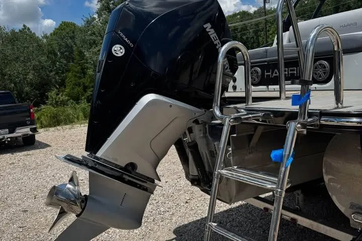 Slide: The Image of 2020 Harris Solstice 250 boat with Mercury outboard motor and stainless steel ladder. - 13
