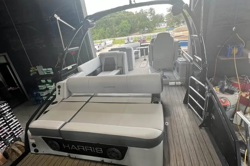 Slide: The Image of 2020 Harris Solstice 250 boat interior with spacious seating and modern design. - 14