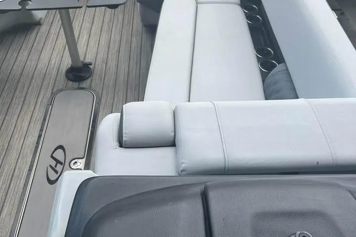 Slide: The Image of 2020 Harris Solstice 250 boat interior with sleek seating and cup holders. - 4