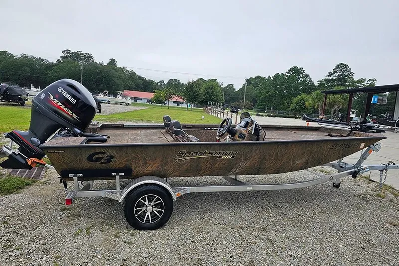 Slide: The Image of 2023 G3 Sportsman 1810 Camo boat with Yamaha motor on a trailer. - 0