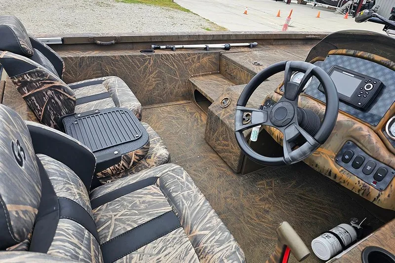 Slide: The Image of 2023 G3 Sportsman 1810 Camo boat interior with camo seats and steering console. - 10