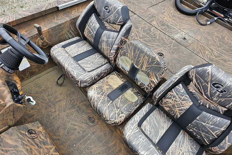 Slide: The Image of 2023 G3 Sportsman 1810 Camo boat interior with camouflage seating and steering wheel. - 12