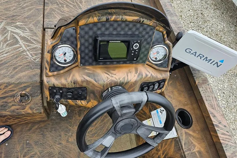 Slide: The Image of 2023 G3 Sportsman 1810 Camo boat dashboard with Garmin and Humminbird electronics. - 13