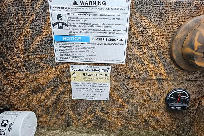 Slide: The Image of 2023 G3 Sportsman 1810 Camo boat warning labels and capacity information. - 14