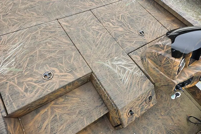 Slide: The Image of 2023 G3 Sportsman 1810 Camo boat deck with camouflage pattern and storage compartments. - 15