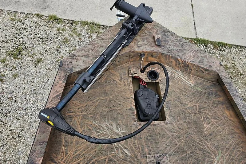 Slide: The Image of 2023 G3 Sportsman 1810 Camo boat with trolling motor and camo design. - 17