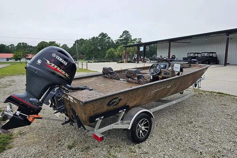 Slide: The Image of 2023 G3 Sportsman 1810 Camo boat with Yamaha motor on trailer. - 2