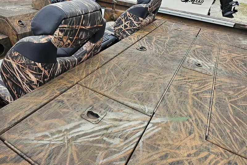 Slide: The Image of 2023 G3 Sportsman 1810 Camo boat interior with camouflage seating and deck. - 8