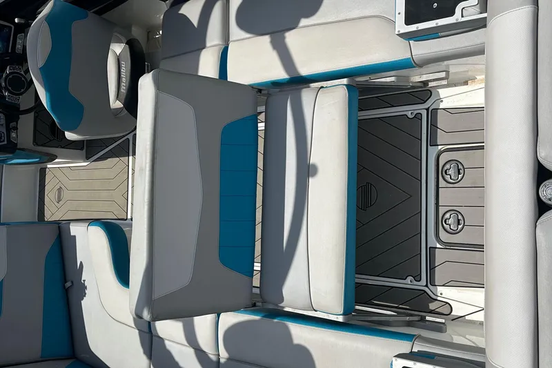 Slide: The Image of 2018 Malibu Wakesetter 23 LSV interior with gray and blue seating, modern design. - 10