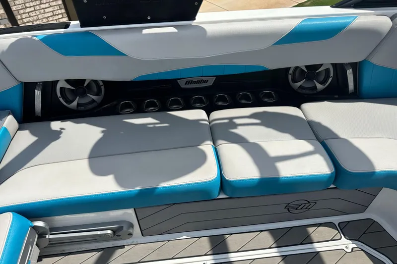 Slide: The Image of Interior seating of 2018 Malibu Wakesetter 23 LSV with blue and gray upholstery. - 12