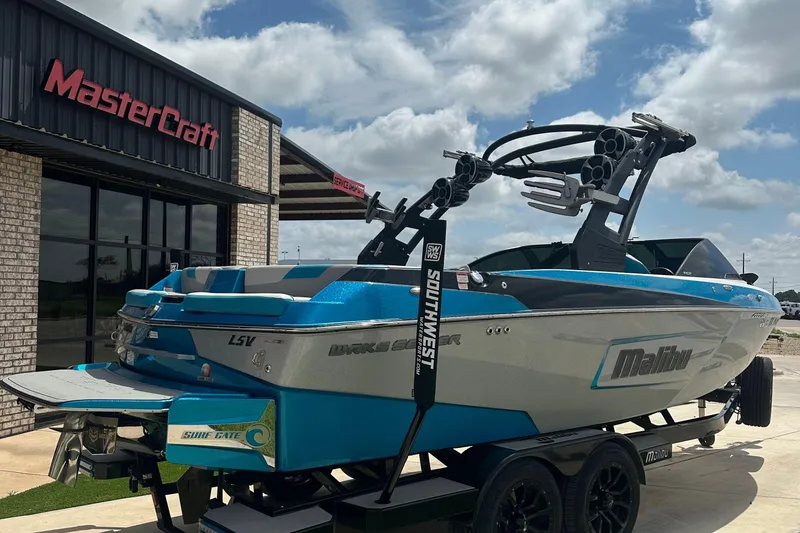 Slide: The Image of 2018 Malibu Wakesetter 23 LSV boat parked outside MasterCraft dealership. - 3