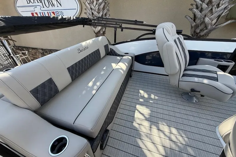 Slide: The Image of 2021 Barletta L23UC boat interior with plush seating and modern design. - 12