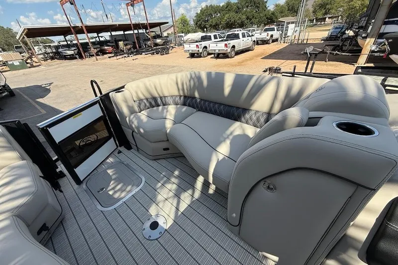 Slide: The Image of Luxurious seating on 2021 Barletta L23UC pontoon boat, featuring elegant upholstery and spacious layout. - 13