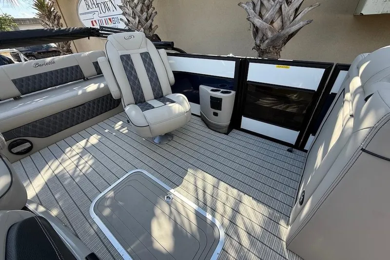 Slide: The Image of 2021 Barletta L23UC boat interior with luxurious seating and modern design. - 15