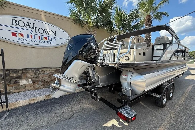Slide: The Image of 2021 Barletta L23UC pontoon boat on trailer at Boat Town dealership. - 5