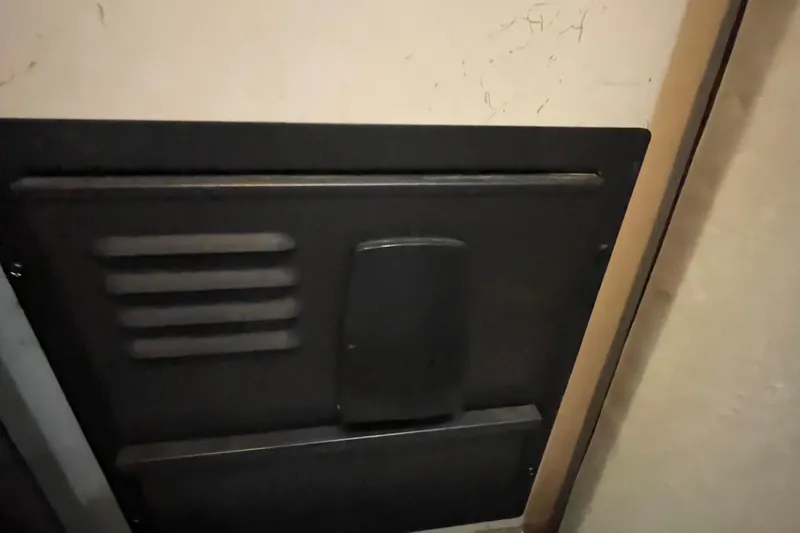 Slide: The Image of 1989 Bayliner Pilothouse 4588 interior panel with vented design. - 16