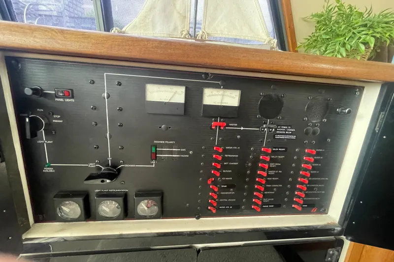 Slide: The Image of 1989 Bayliner Pilothouse 4588 control panel with switches and gauges. - 20