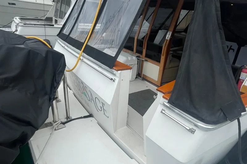 Slide: The Image of 1989 Bayliner Pilothouse 4588 yacht with covered deck and visible interior. - 3