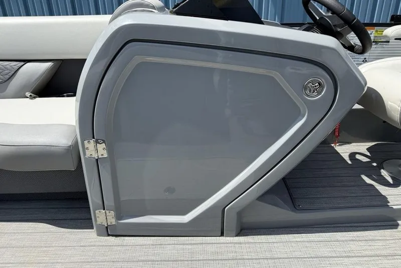 Slide: The Image of 2021 Godfrey Monaco 235 SFL GTP boat helm with sleek gray design and comfortable seating. - 12