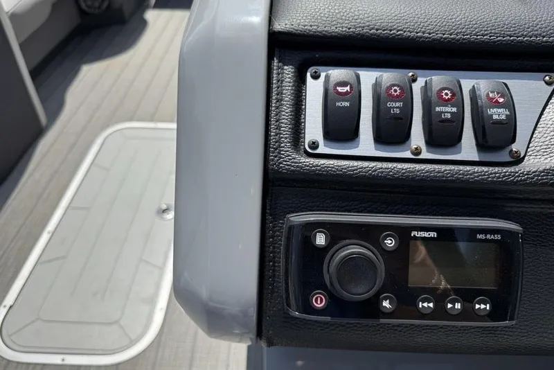 Slide: The Image of Control panel of 2021 Godfrey Monaco 235 SFL GTP boat with switches and Fusion audio system. - 17