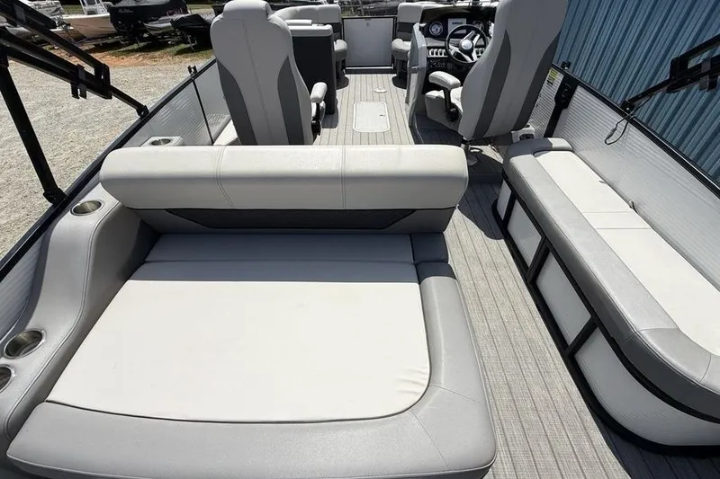 Slide: The Image of 2021 Godfrey Monaco 235 SFL GTP boat interior with plush seating and modern helm. - 20