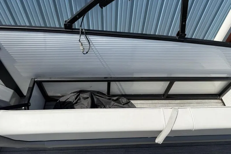 Slide: The Image of 2021 Godfrey Monaco 235 SFL GTP boat storage compartment with cover, open and empty. - 24
