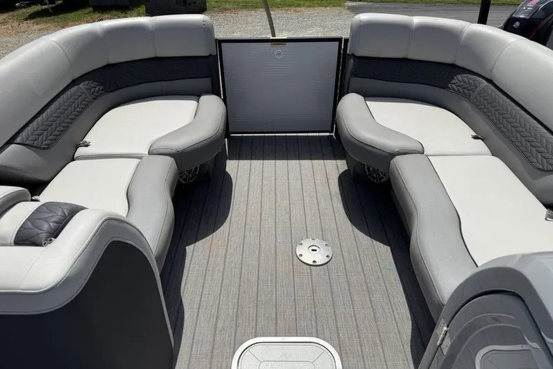 Slide: The Image of Luxurious seating on 2021 Godfrey Monaco 235 SFL GTP pontoon boat, featuring elegant gray upholstery. - 5