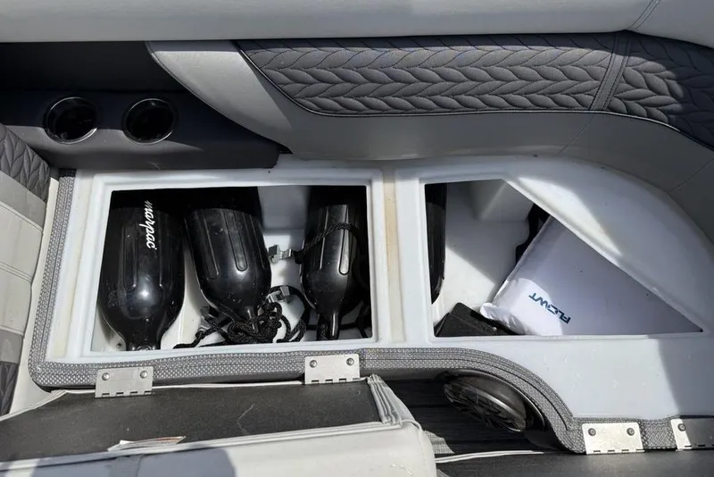 Slide: The Image of Storage compartment in 2021 Godfrey Monaco 235 SFL GTP boat, featuring fenders and accessories. - 6
