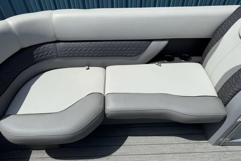 Slide: The Image of Luxurious seating on 2021 Godfrey Monaco 235 SFL GTP pontoon boat, featuring elegant gray upholstery. - 7