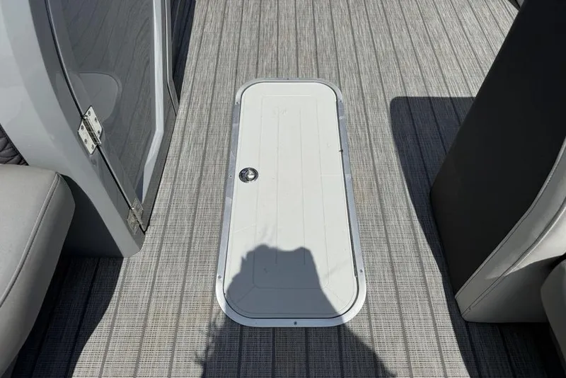 Slide: The Image of Floor hatch on 2021 Godfrey Monaco 235 SFL GTP boat, featuring sleek design and modern materials. - 8