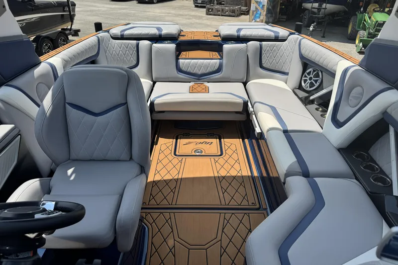 Slide: The Image of 2021 Tigé 23ZX boat interior with luxurious seating and stylish design. - 10