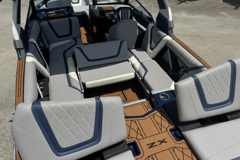 Slide: The Image of 2021 Tigé 23ZX boat interior with luxurious seating and modern design. - 11
