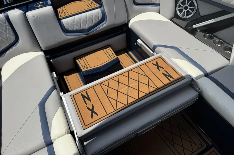 Slide: The Image of 2021 Tigé 23ZX boat interior with luxurious seating and stylish wood accents. - 13