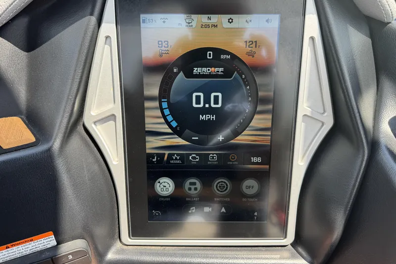 Slide: The Image of 2021 Tigé 23ZX boat dashboard display showing speed, temperature, and control settings. - 14